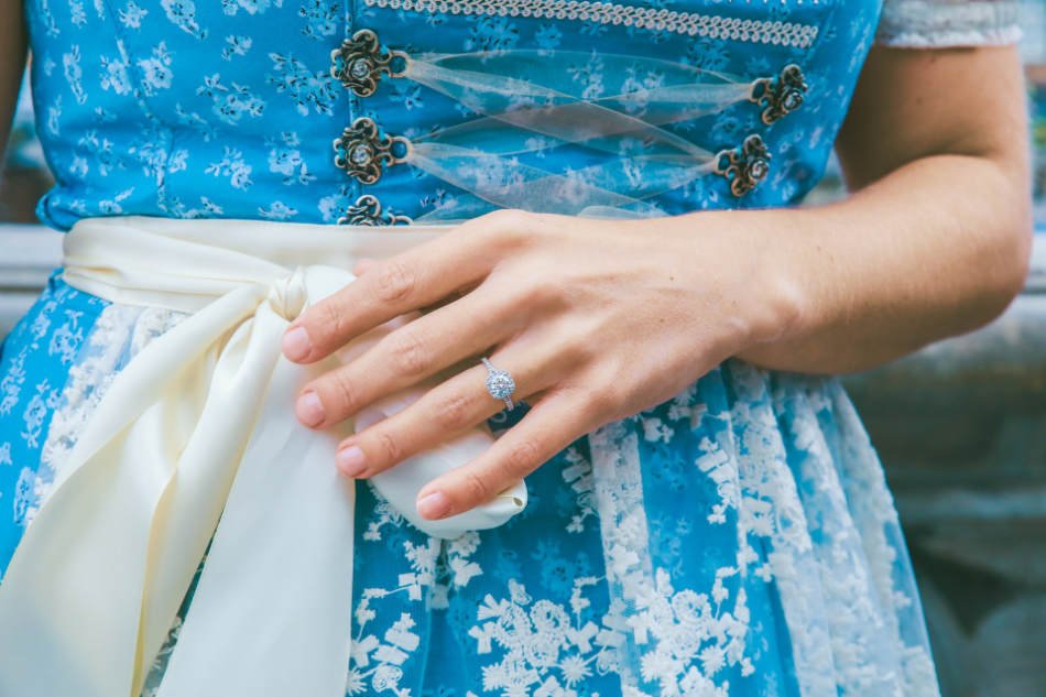 Copywriting lessons from Bridgerton: girl in blue regency dress with engagment ring